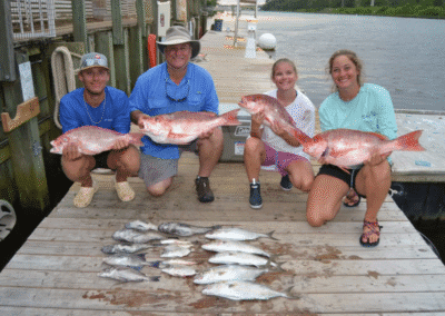 family fishing pose